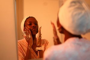 Woman checking skincare ingredients
